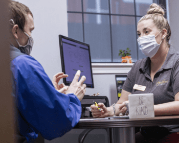 woman talking to man in office