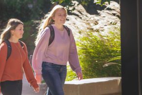 Two students walking outside on Pfeiffer's campus