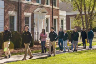 Students walking outside in a line