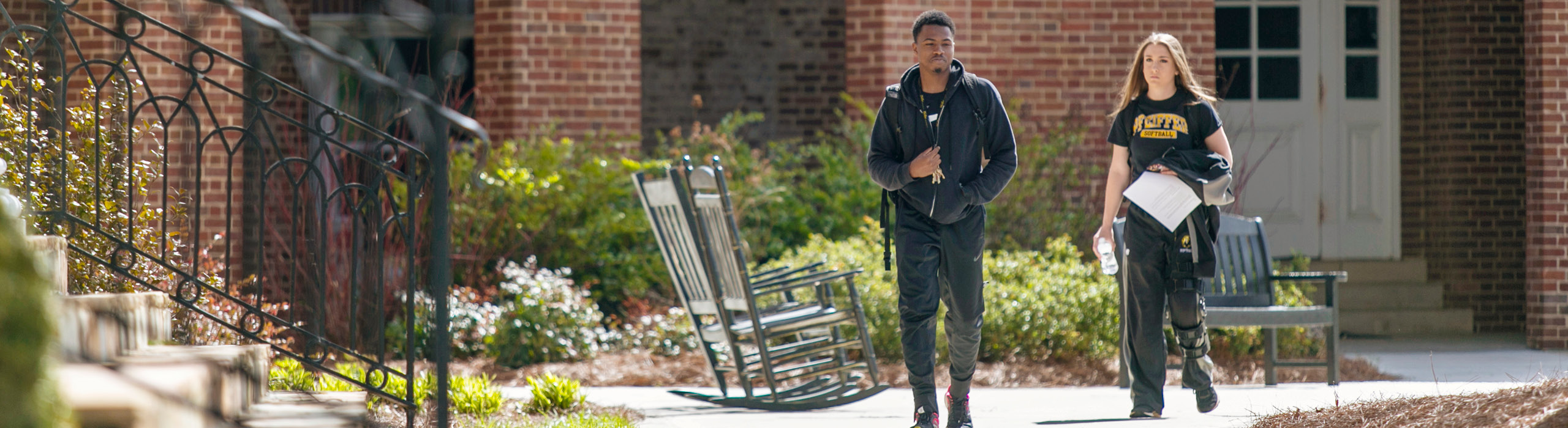 Two students walking together on campus
