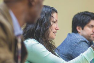Student pointing and talking in class