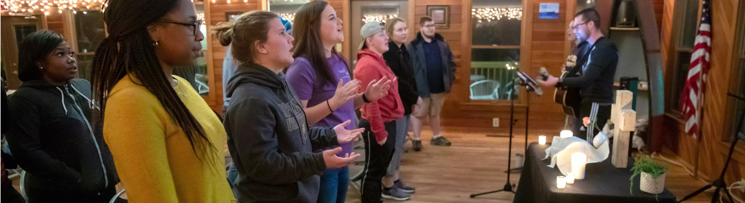 Students singing while band plays